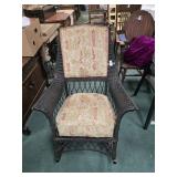 Black wicker rocking chair.