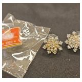 Pair of stud earrings and a wounded warrior