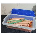 Small tote full of Lincoln logs