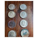Group of 8 1968 Kennedy half dollars some are