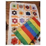 Handmade quilt in rough shape and a pencil