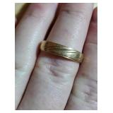 Gold wedding band style ring marked 10K and also