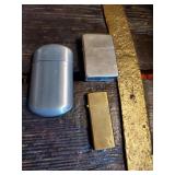 Group of 3 lighters one is a zippo and 1 is
