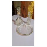 Grouping of glass including canister and oil