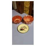 Copper pans and a little plate