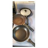 3 small skillets and a lid