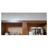 Contents on shelf including glasses