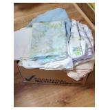 Box of freshly washed twin sheets