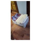 Box of freshly washed twin sized sheets