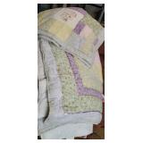 Very pretty pastel colored quilt and 2 shams
