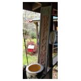 Welcome sign and flower pot