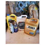 3 partial jugs of antifreeze and wd40