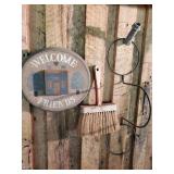 Welcome friends sign, brush and metal