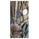 Group of rakes and brooms