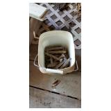 Bucket of railroad spikes
