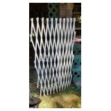 White stretchy fence gate