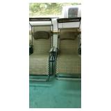 Set of pool or beach chairs with sun shades