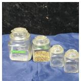 Group of 4 little canisters
