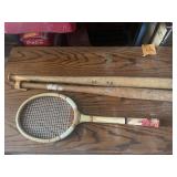 Vintage baseball bats and tennis racket