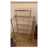 METAL SHELVING WITH ANOTHER LITTLE SHELF ON TOP