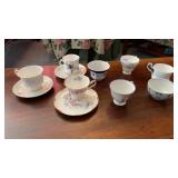 MANY CHINA COFFEE CUPS , SOME WITH SAUCERS