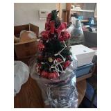 MINIATURE CHRISTMAS TREE THAT IS LIGHTED AND
