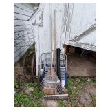 TWO ALUMINUM CHAIRS, A RAKE THREE BROOMS AND