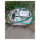 GARDEN HOSE AND NEW ROLL OF LANDSCAPE EDGING