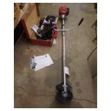 HONDA TREE CUTTER AND A SUITCASE WITH PARTS