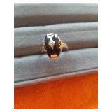 SIZE 6 GOLD RING WITH A BLACK STONE AND DIAMOND