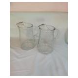 2 MATCHING GLASS PITCHERS