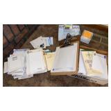 2 CLIP BOARDS, MANY PADS OF NOTE BOOK PAPER,