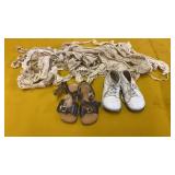 BABY SHOES AND LACE REMNANTS