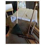 PUSH BROOM AND A LEAF RAKE
