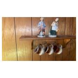 SHELF HOLDING 3 STONEWARE COFFEE  CUPS AND 2