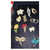11 GOLDEN BROOCHES INCLUDING HUSKS OF CORN
