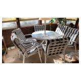 PATIO TABLE WITH LAMP AND 6 PADDED CHAIRS