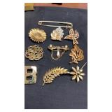 10 GOLDEN BROOCHES