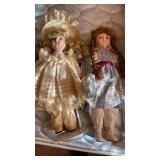 2 DOLLS WITH STANDS