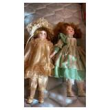 2 DOLLS WITH STANDS
