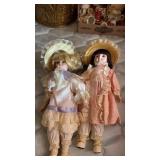 2 DOLLS WITH STANDS