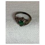 Sterling Ring w/green glass stone, size 1, .03 oz.