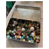 Tin of marbles, cat eyes, shooters, etc. 200+