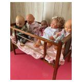 Wood doll crib 26' x 17ï¿½ x 15ï¿½ w/ 5 dolls