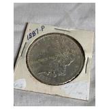 1887 Morgan silver dollar