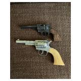 2 toy guns, possibly cap?,  10' longest show wear