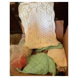 Misc kitchen linens, yarn, aprons, etc show wear