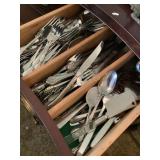 Contents of drawer- 90+ stainless flatware,