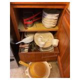 Cabinet contents ï¿½ corning, ware, potato ricer,