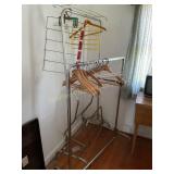 4 metal clothes, racks, some on wheels